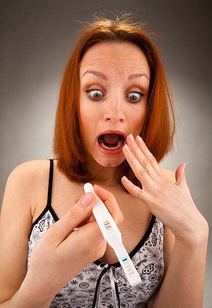 istock Woman with pregnancy test 152967132