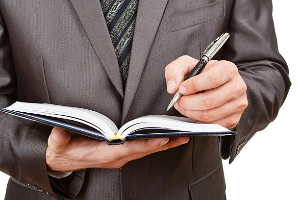 istock Businessman writing in business diary 152967291