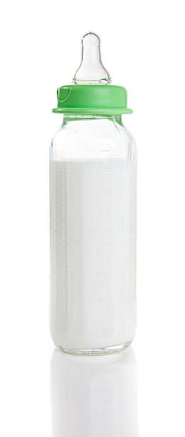 istock Baby bottle with milk (formula) shot on white 152967855