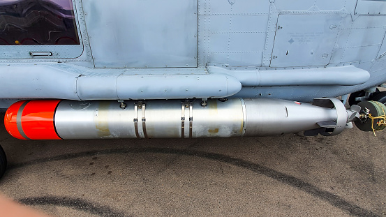A Torpedo Mounted On A Attack Helicopter.