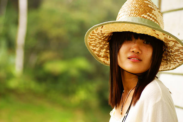 istock Asian girl with straw hat 152968179