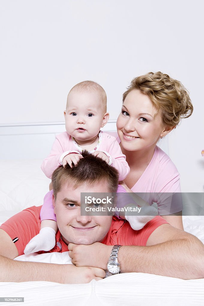 Happy young and joyful family people Faces of the happy young and joyful family people at home Adult Stock Photo