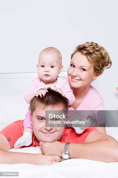 Happy Young And Joyful Family People Stock Photo - Download Image Now - Adult, Affectionate, Baby - Human Age