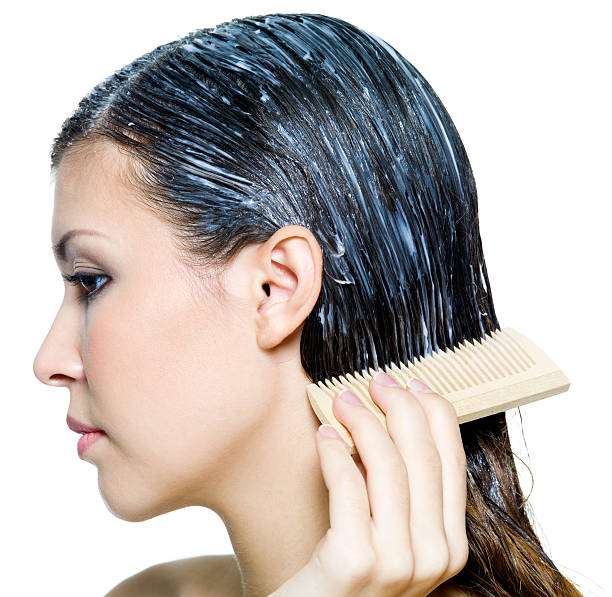 istock beautiful young woman dyeing hairs 152968374