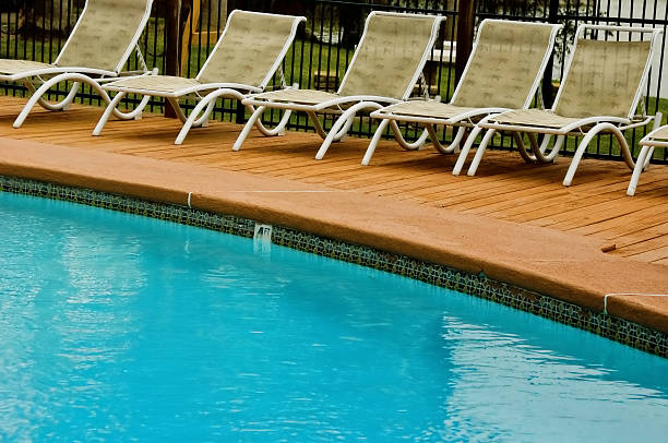 istock chairs near swimming pool 152968797
