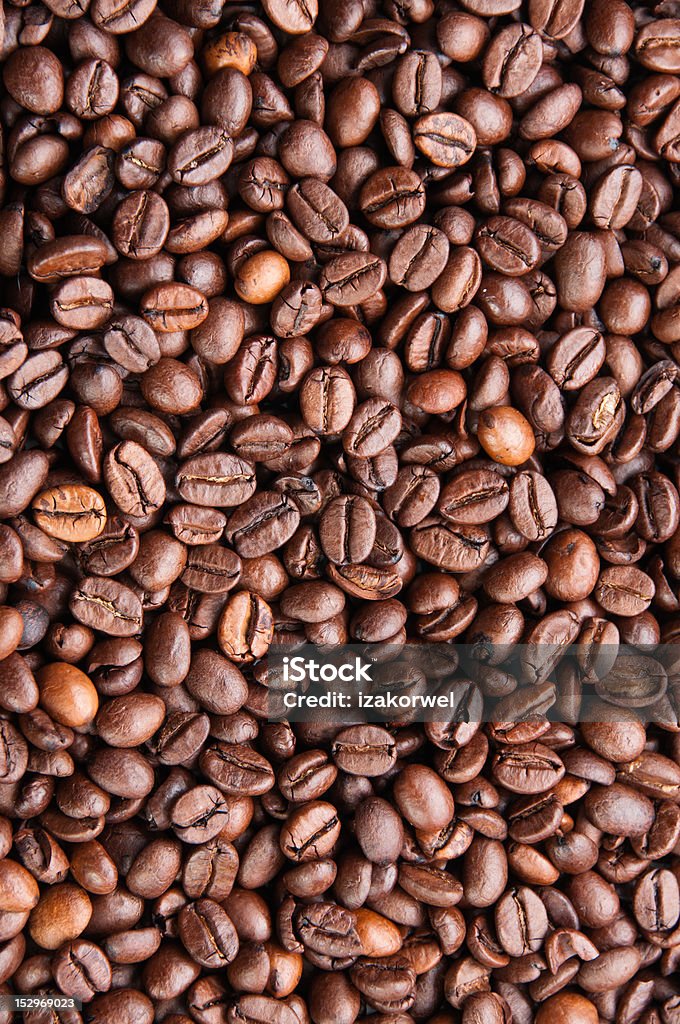 Dark roasted coffee beans texture Dark roasted coffee beans texture, overhead, vertical Backgrounds Stock Photo