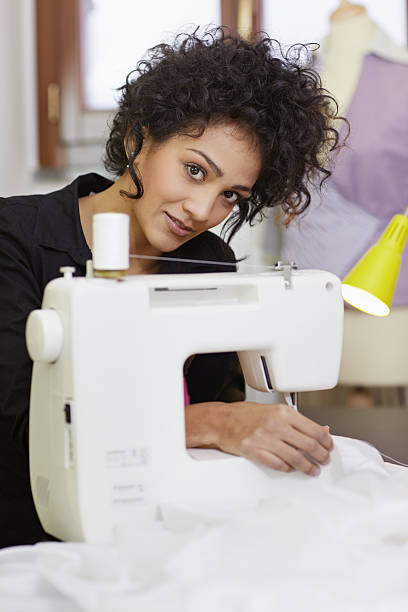 istock Fashion designer with sewing machine 152969032