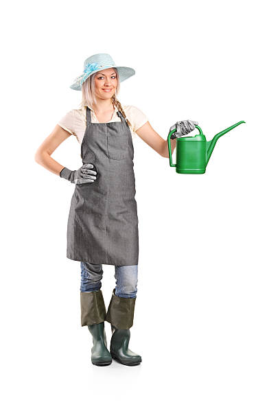 istock Smiling female gardener with watering can 152969829