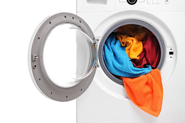 istock Close up of a washing machine loaded with clothes 152969834