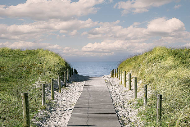 footpath to the sea stock photo