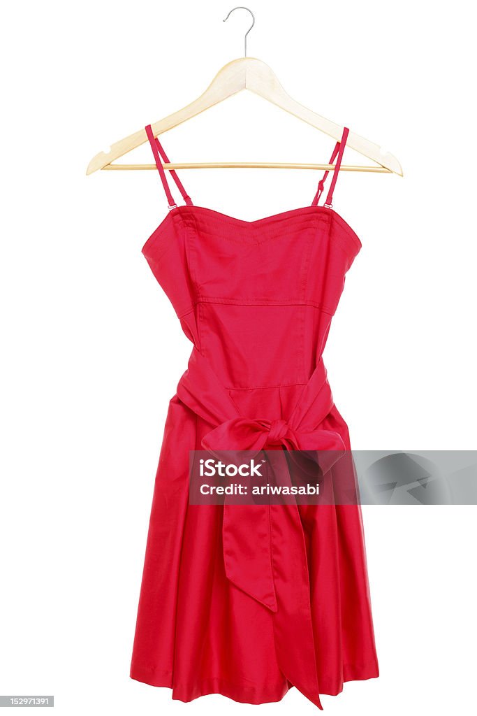 Red dress on hanger isolated Red dress on hanger isolated on white background. See more Dress Stock Photo