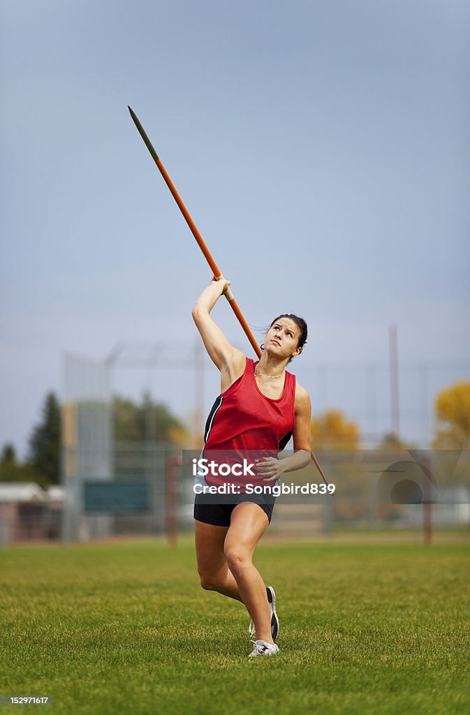 Javelin A young, female athlete throwing a javelin in a track and field event. Track And Field Stock Photo