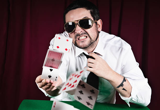 Poker player throwing cards with rage stock photo