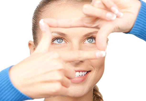 istock lovely woman creating a frame with fingers 152972253
