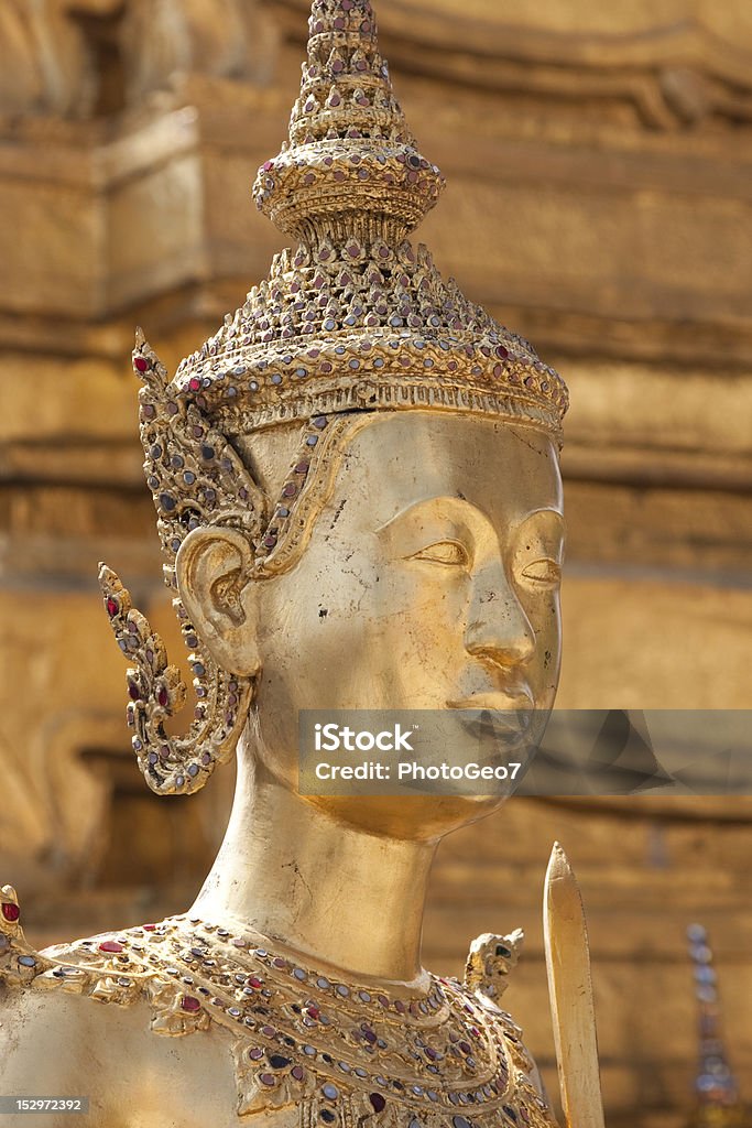 Golden statue Golden statue in Wat Phra Kaeo, Bangkok, ThaÃ¯land Asia Stock Photo