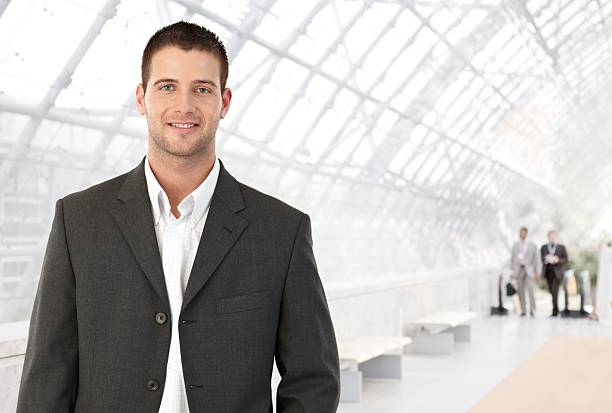 istock Young businessman in office lobby 152972733