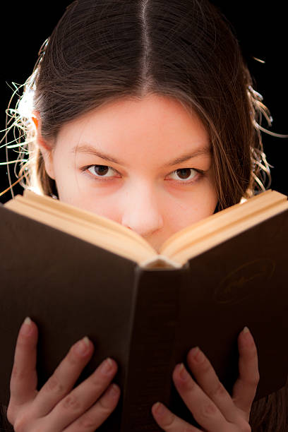 istock charming  woman with a book in hands 152973648