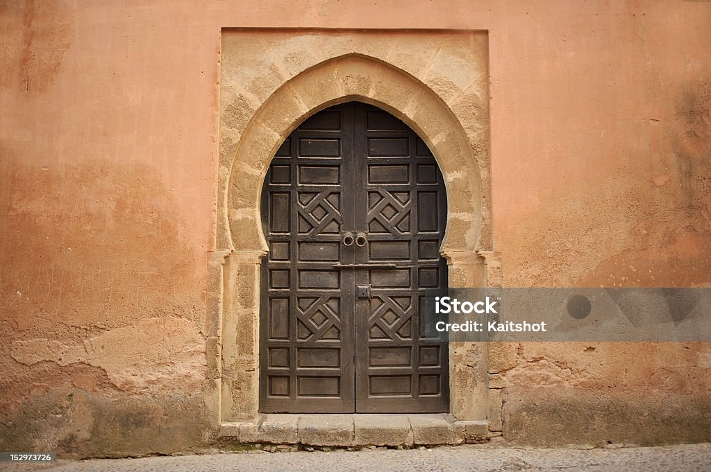 Arabic old style door Arabic old style door to a house in an orange wall Antique Stock Photo