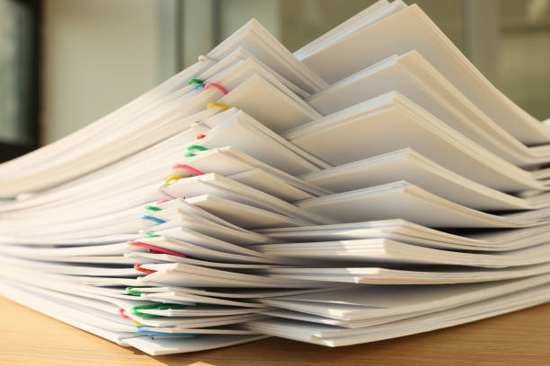 istock A stack of paper with colored paper clips, close-up 1529744056