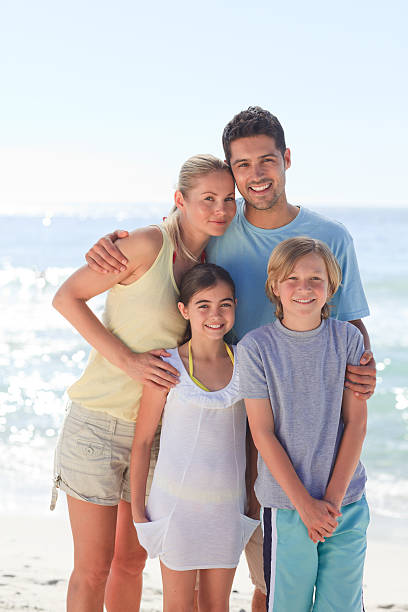 istock Joyful family at the beach 152975270