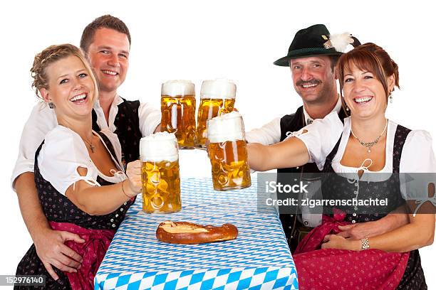 Bavarian Men And Women Toast With Beer Fest Beer Stein Stock Photo - Download Image Now