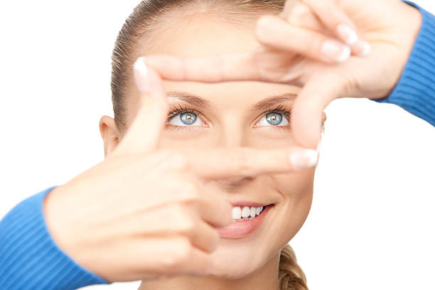 istock lovely woman creating a frame with fingers 152976788