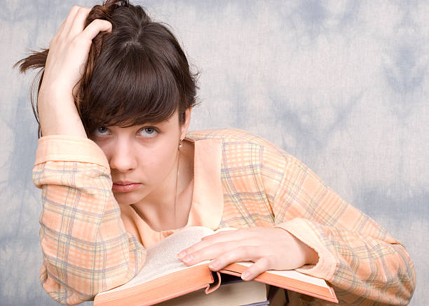 istock The young girl with books 152978470