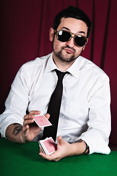 Poker player mixing cards stock photo