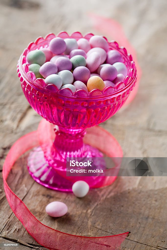 Easter candy Colorful easter candy in pink glass bowl Bowl Stock Photo