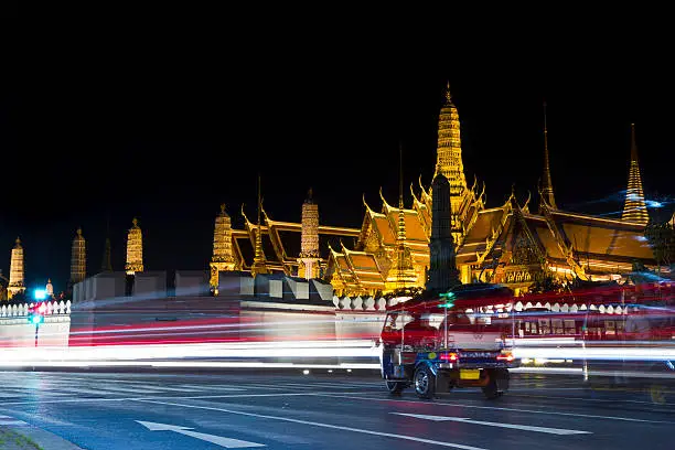 a motor tricycle in the Temple of the Emerald Buddha at night , in Bangkok , Thailand ,