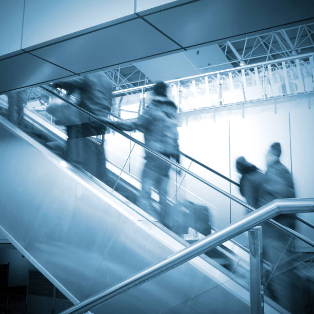 istock People at the airport escalator 152980671