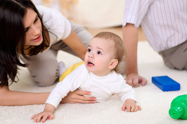 istock baby with a mother at home 152980795