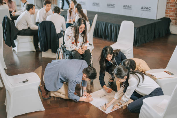 istock Multi Ethnic group of young entrepreneur participate in business conference workshop brainstorming with creative ideas and concept 1529812375