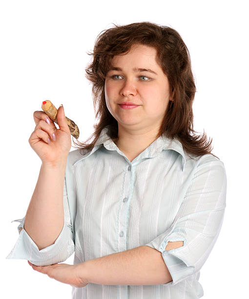 Chubby girl in white shirt with pencil. stock photo