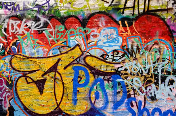 Wall covered with graffiti tags