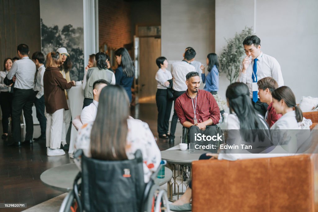 Asian Multi Ethnic business people talk during a coffee break in Seminar Business conference Diversify Asian seminar participants casual chat after successful conference event at lounge stock photo Convention Center Stock Photo