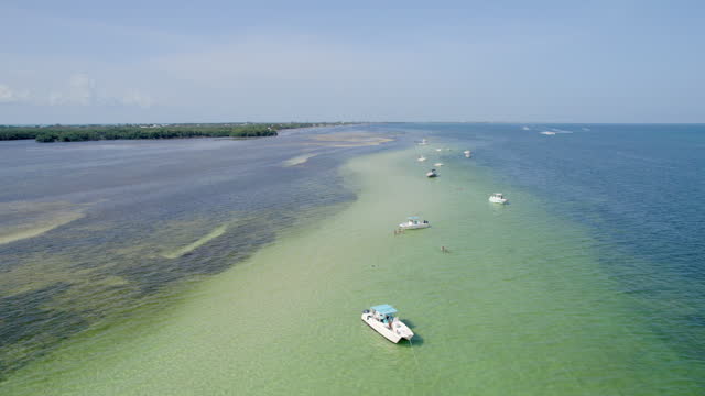Boats moored in a sandbar in Marathon, Florida keys
