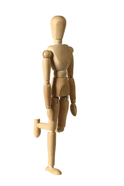 istock Wooden Figure Standing On One Leg 152983385