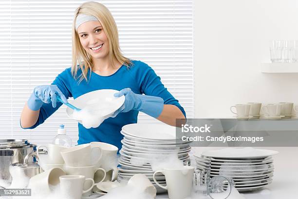 Modern Kitchen Happy Woman Washing Dishes Stock Photo - Download Image Now - Adult, Blond Hair, Blue