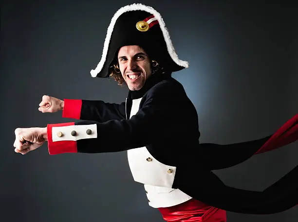 Young adult wearing a Napoleon costume suit.