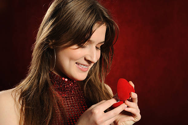 istock Beautiful woman with a heart gift 152985557