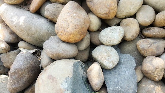 Natural background of piles of cobblestones or pebbles