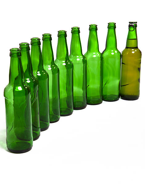 istock Empty glass bottles and one full in end of number 152985886