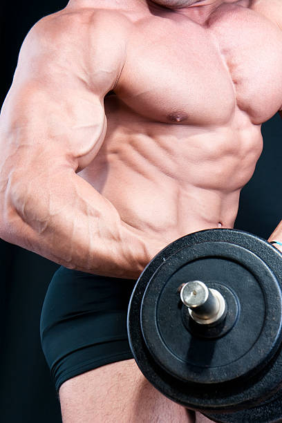 istock Athletic sexy attractive male body builder, demonstrating contest pose 152986272