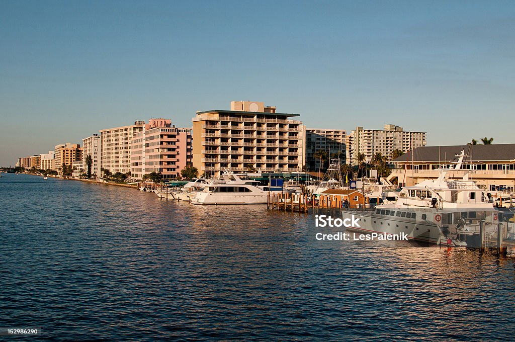 Apartments and boats on Intracoastal Waterway in Ft Lauderdale Residential buildings and large leisure boats mooring along the Intracoastal Waterway in Ft Lauderdale Blue Stock Photo