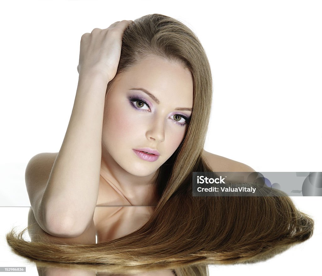 Portrait of beautiful teen girl with long straight hair Portrait of beautiful teen girl with long straight hair, isolated on white background Adult Stock Photo