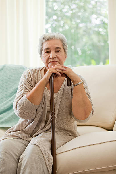 istock Senior woman with her walking stick 152987028