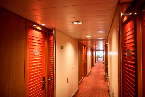 Corridor with numbers doors at sea cruise ship