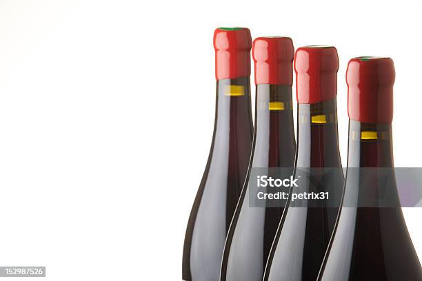 Cuatro Botellas De Vino Tinto Foto de stock y más banco de imágenes de Vino tinto - Vino tinto, Botella, Cera