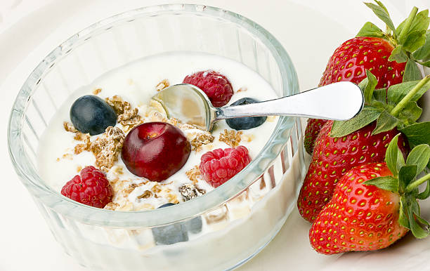 istock Yogurt and a variation of fresh  fruit in glass bowl. 152988691